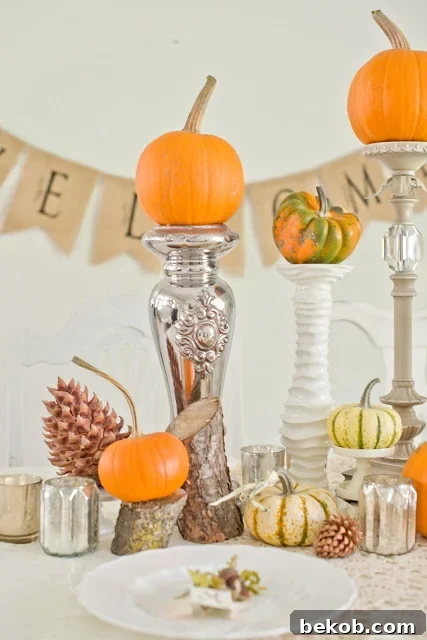 Stunning Pumpkin Centerpieces: Elevate Your Fall Table 18 Pumpkin centerpiece with mercury glass accents