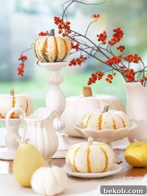 Stunning Pumpkin Centerpieces: Elevate Your Fall Table 23 White dinnerware paired with small pumpkins and gourds