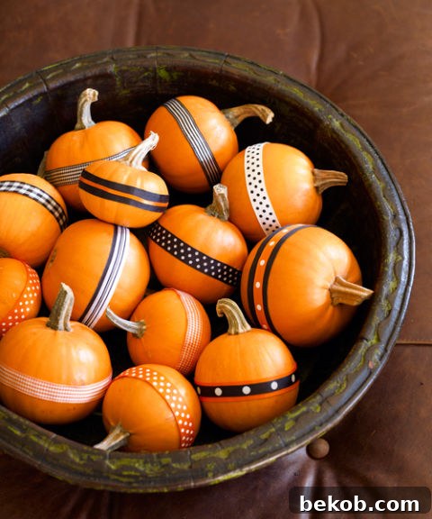 Stunning Pumpkin Centerpieces: Elevate Your Fall Table 24 Ribbon or washi tape mini pumpkins
