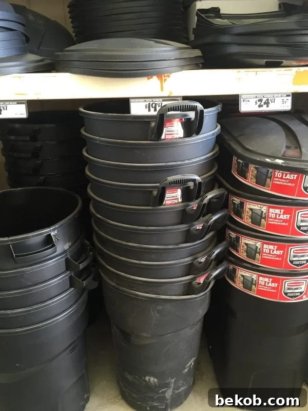 Rubbermaid Roughneck 32-Gal Black Wheeled Trash Can with Lid