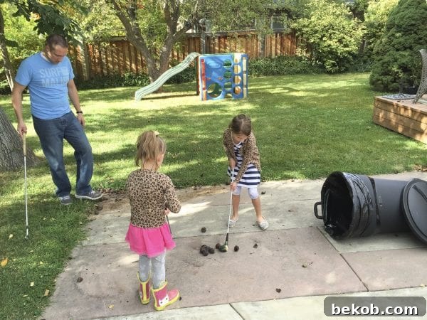 Family members playing golf with walnuts in the backyard
