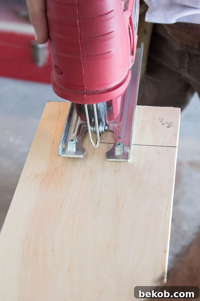 Cutting the sill with a jigsaw