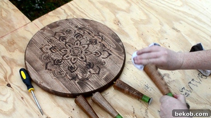 Wiping off excess stain to achieve the desired effect