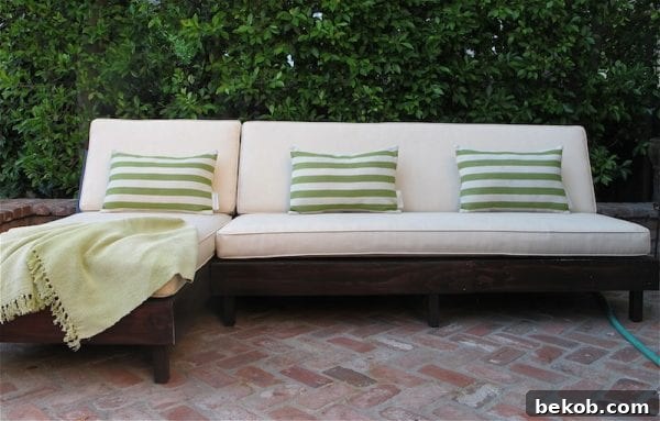 Transformed old indoor sofa repurposed into a stylish outdoor seating arrangement.