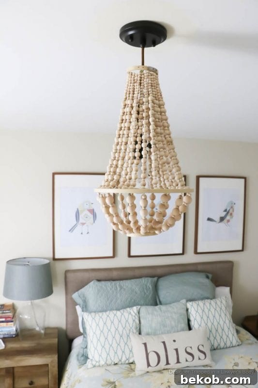 WOW! Come learn how to make your own wood bead chandelier with this awesome tutorial by Designer Trapped in a Lawyer's Body for Remodelaholic.com!