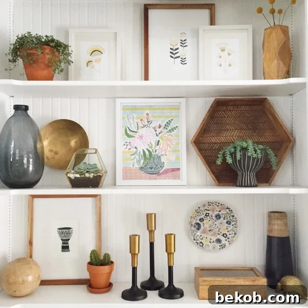 Evolving Dining Spaces Banquette Style 10 Close-up of decorative shelving above a dining room banquette, featuring art, a hexagon tray, and warm wood and gold accents.