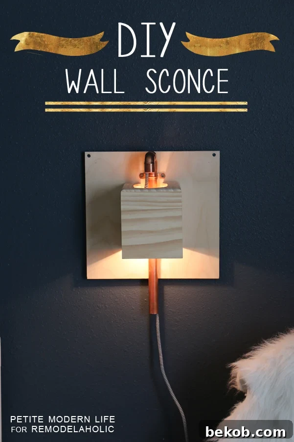 Make this industrial modern, apartment friendly DIY wall sconce with the simplest of materials!