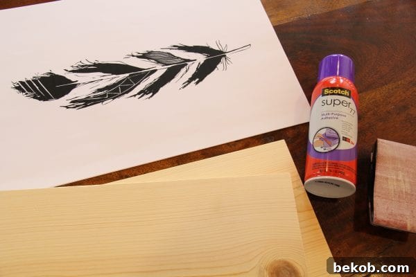 DIY hand-drawn feather prints mounted on wood @Remodelaholic