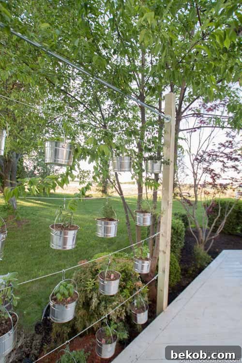 This suspended vertical garden is a great weekend DIY! Perfect for an herb garden or some beautiful flowers, and the kids could plant their own seeds in the lower rows. Tutorial from The Heathered Nest on @Remodelaholic.