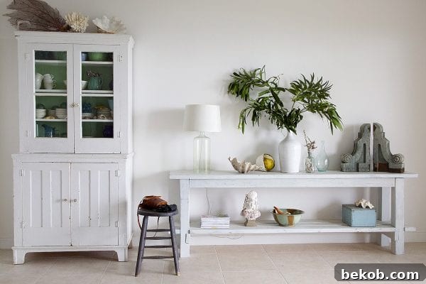 This smart no-nails console table is easy to build, and easy to disassemble for easy moving and transportation, making it ideal for renters, military families, vacation homes, or even parties. Plus, the layered milk paint finish makes it perfect! Get the details from Shabbyfufu on Remodelaholic.com