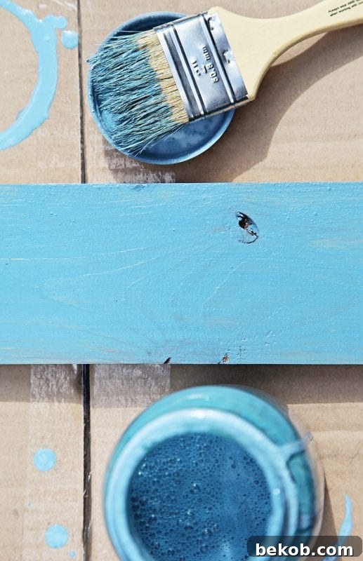Miss Mustard Seed French Enamel milk paint creates a beach-inspired look in a DIY console table by Shabbyfufu featured on @Remodelaholic