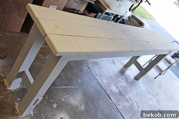 Tutorial for building and painting a beachy console table using two colors of Miss Mustard Seed Milk Paint by Shabbyfufu featured on @Remodelaholic