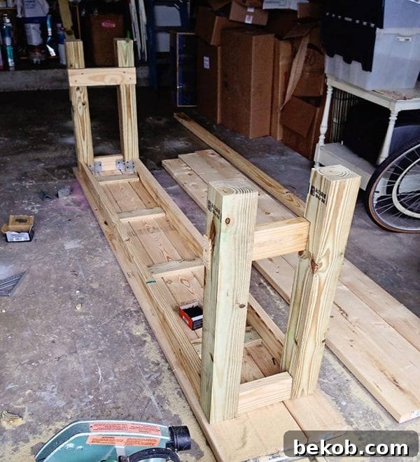 Tutorial for assembling the upper frame of the beach-inspired console table using metal angle brackets for a no-nails construction. Shabbyfufu design featured on @Remodelaholic