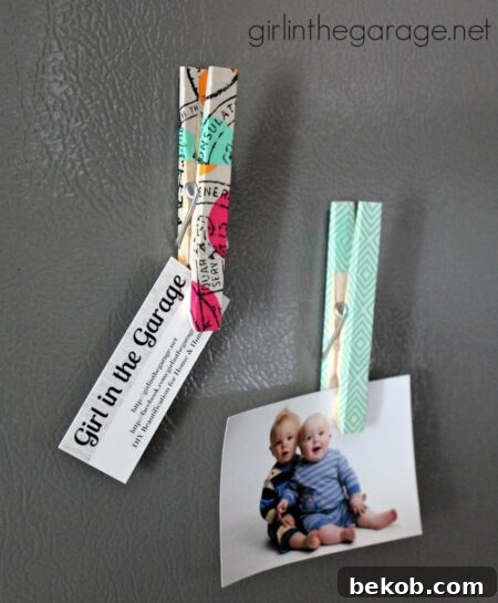 Clothespin magnets decorated with colorful washi tape patterns, ideal for holding notes or photos.
