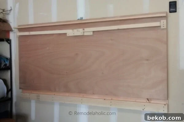 DIY Wall Mounted Folding Table For The Garage Remodelaholic