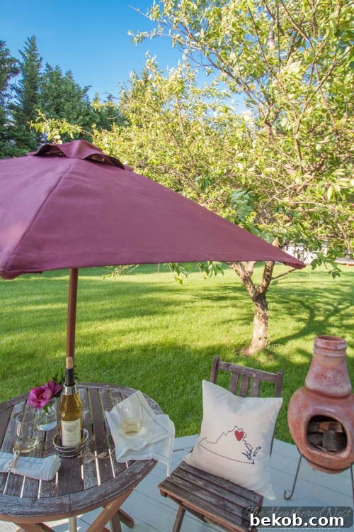 DIY painted patio umbrella makeover for a dramatic outdoor effect by The Heathered Nest
