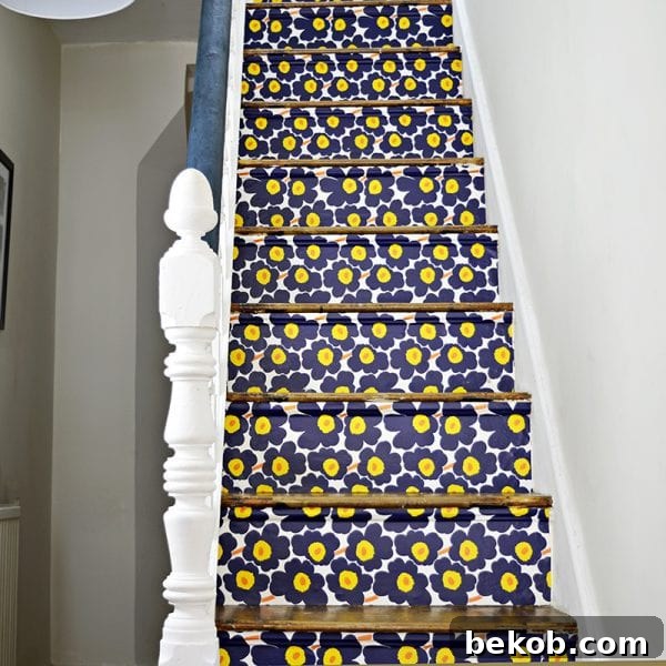 Bold floral wallpaper transformation on stair risers by Pillar Box Blue