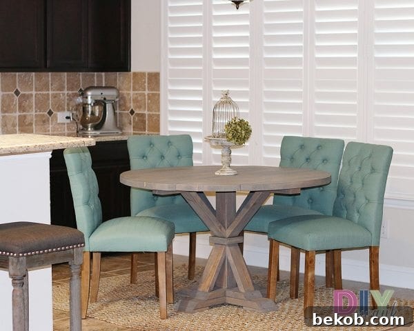 Stunning DIY round farmhouse table with a beautiful base by DIY Swank