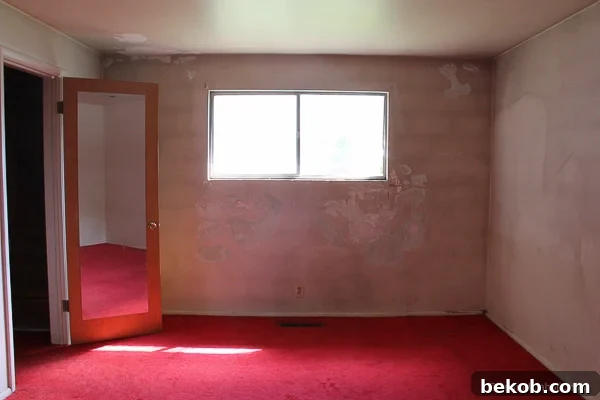 Ultimate Master Bedroom Oasis 2 Old master bedroom with bright red carpet before renovation starts