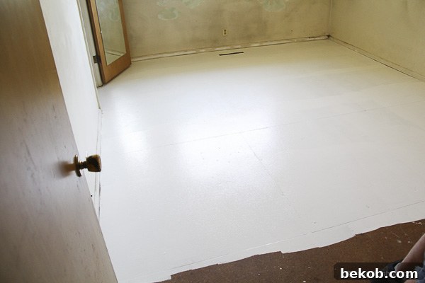 Ultimate Master Bedroom Oasis 4 Subfloor of master bedroom painted a temporary grey, post-carpet removal