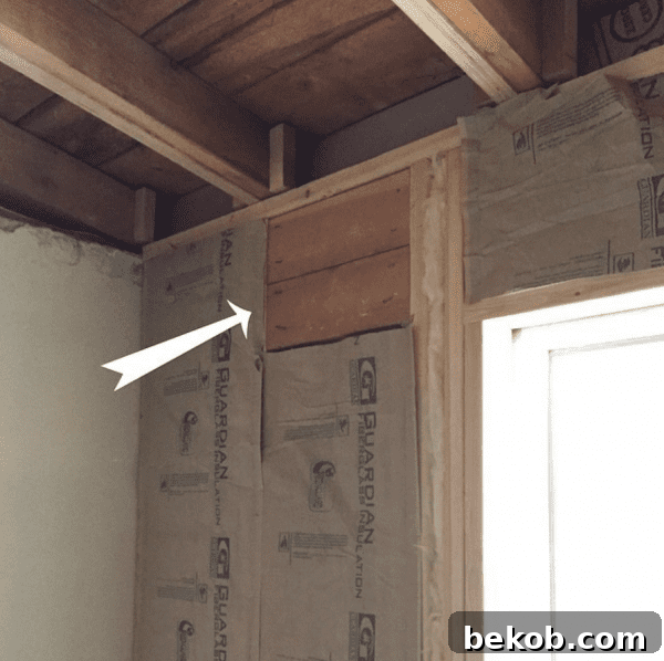 Ultimate Master Bedroom Oasis 7 Window with wooden blocking installed behind future drywall for drapery rods