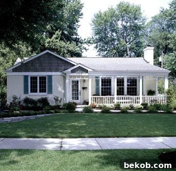 Charming home with vibrant window boxes and a welcoming front door, offering ideas for color and detail.