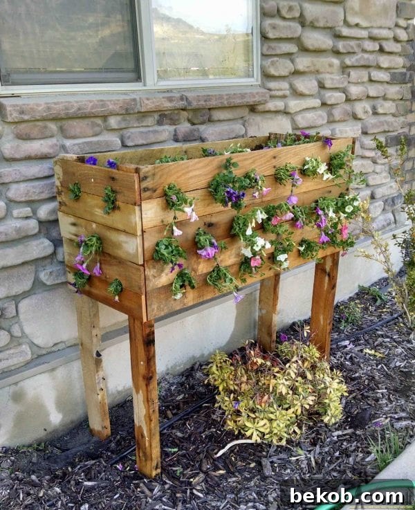 cascading-pallet-planter-flowers-her-toolbelt