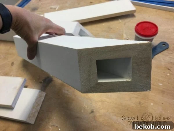 Close-up of corbel assembly using instant-set glue and clamps.
