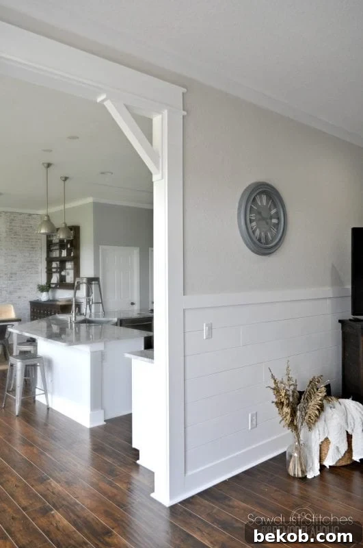The completed DIY craftsman door casing and corbels after painting, showcasing the stunning transformation.