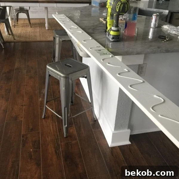 Applying liquid nails to the interior top casing board before installation.