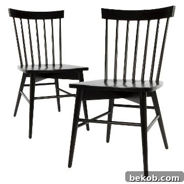 Rustic farmhouse dining room chair idea: classic black Windsor chair provides a traditional, sturdy alternative to modern wishbone chairs.