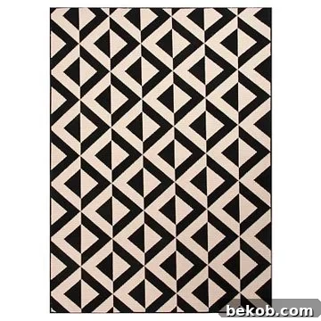 Modern dining room design idea: bold black and white graphic rug introduces contemporary patterns and clean lines for a chic aesthetic.