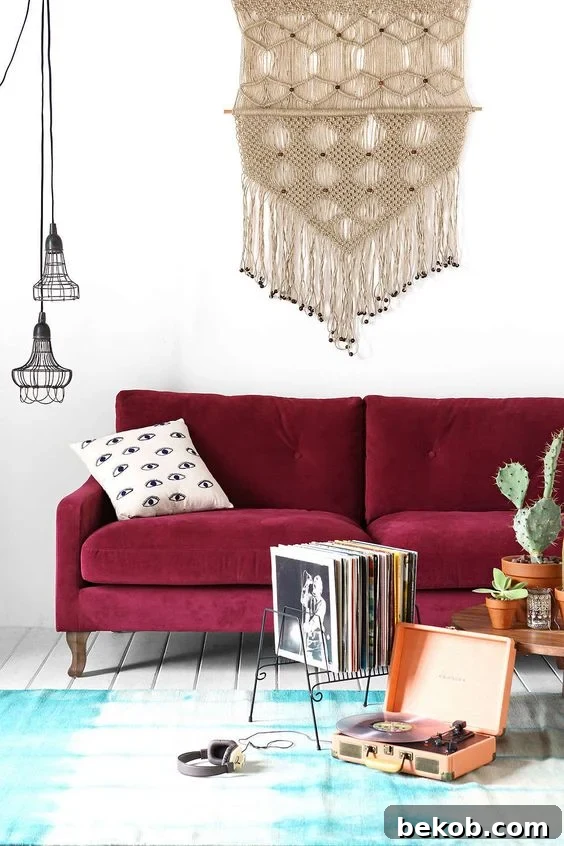 Decorating a neutral living room, with a burgundy couch